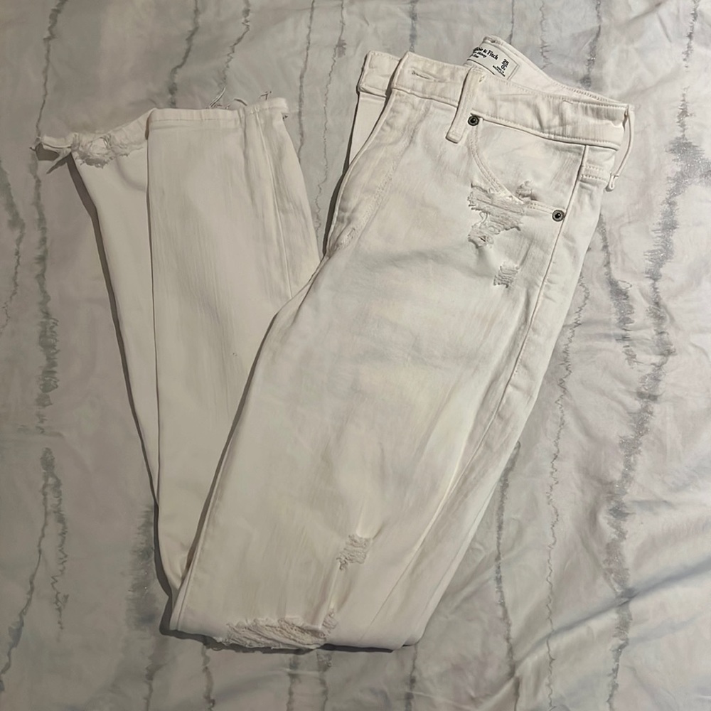 White skinny Abercrombie and Fitch jeans. Distressed at the knees.